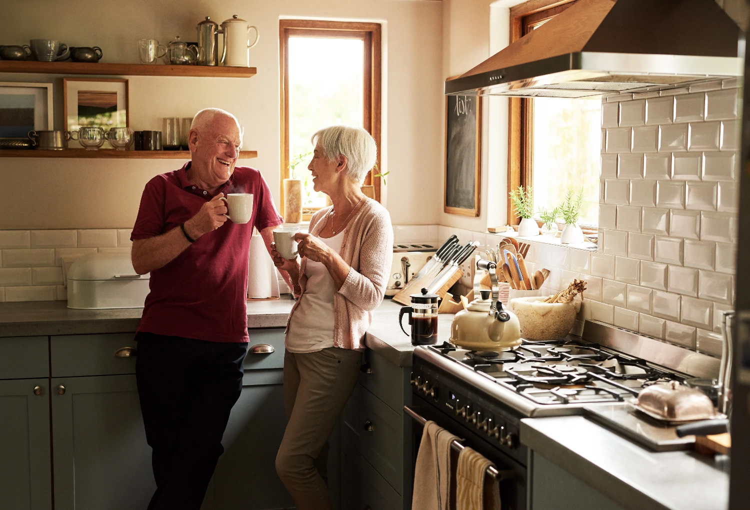 elderly couple having coffee