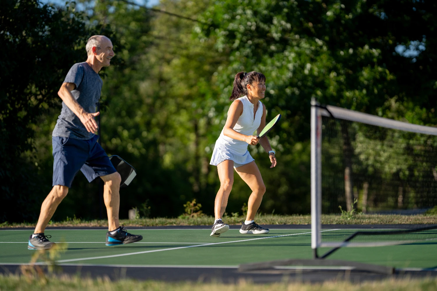 man and woman playing pickle ball